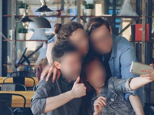 The same cafe scene with every face blurred by HideFace