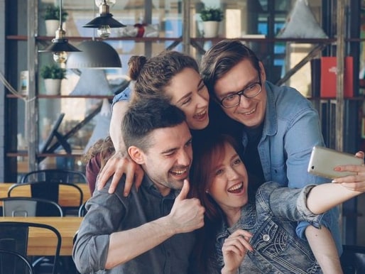 A group of people in a cafe before censoring, faces visible
