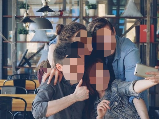 The same cafe photo with every face hidden behind pixelation