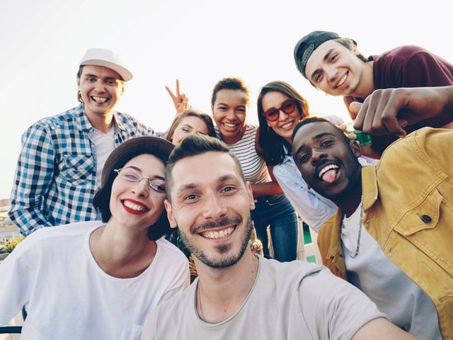 A group of people before censoring, faces visible