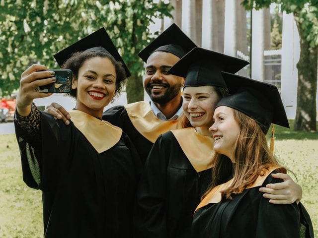 A graduation group photo before censoring, faces visible