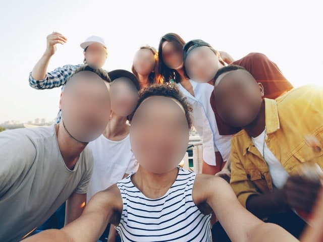 The same shot with the face blurred by HideFace
